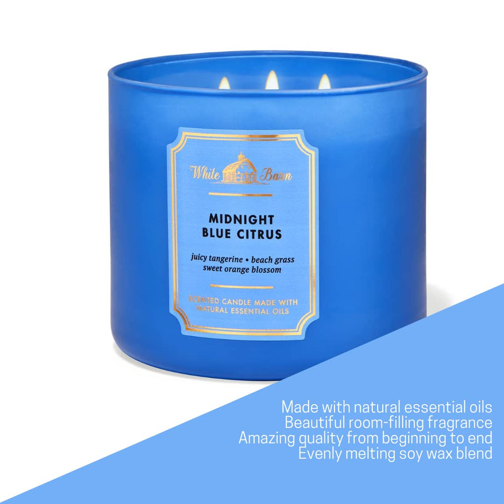 Blue glass candle container with 3-wick design