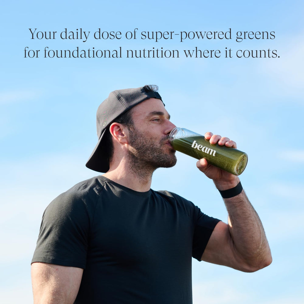 Daily dose scoop next to Beam Greens Powder tub