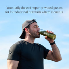 Daily dose scoop next to Beam Greens Powder tub