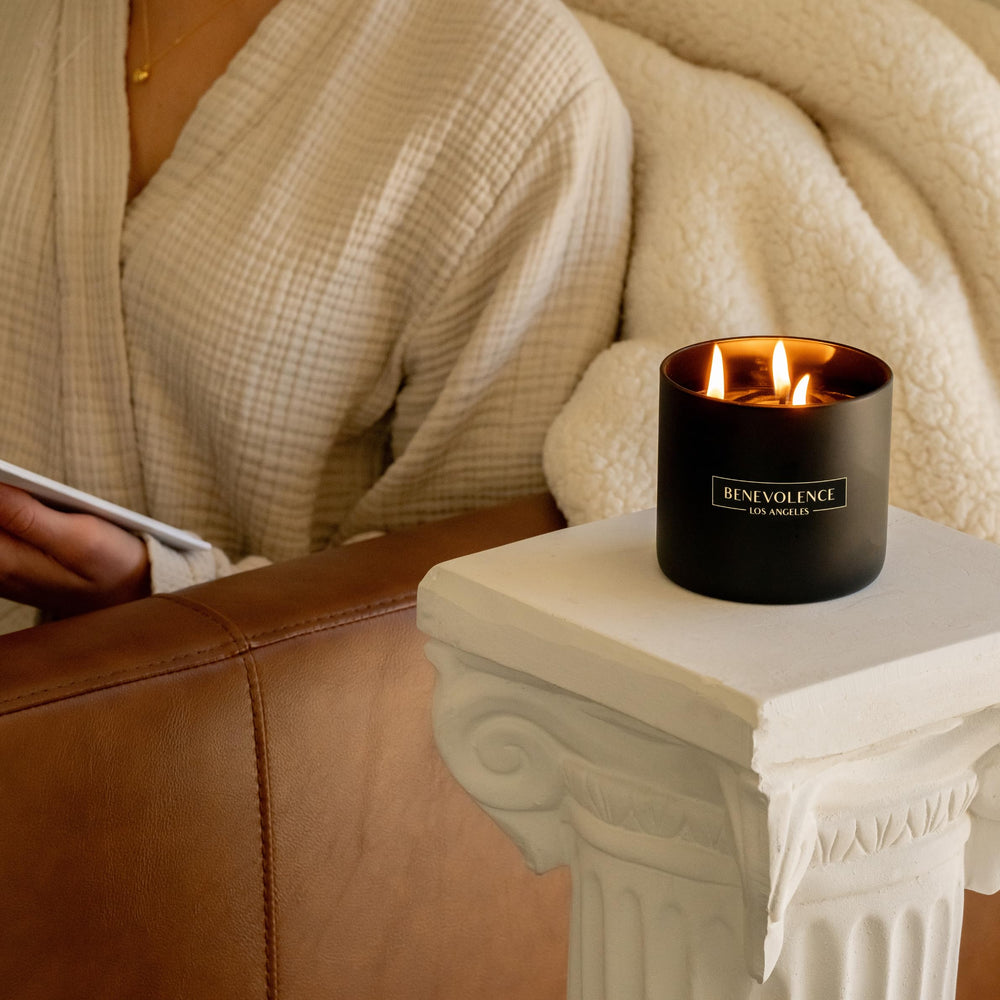 Lit Benevolence LA 3-Wick Candle with warm glow