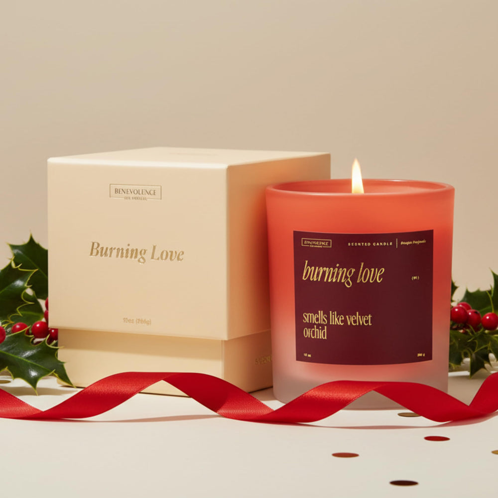 Lifestyle shot of Burning Love candle on a coffee table with roses