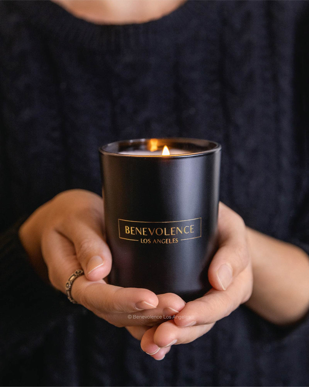 Side view of Benevolence LA Bergamot & Jasmine 6oz clearance candle in matte black jar