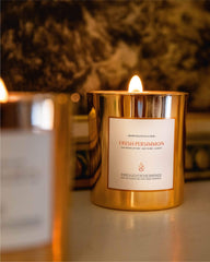 8oz Persimmon candle burning to showcase warm aroma