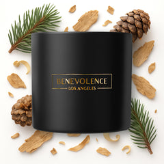 Close-up of Benevolence LA Pine Wood Scented Candle label showing pine aroma