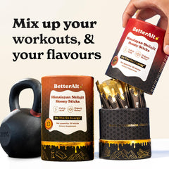 Hand holding BetterAlt Shilajit Sticks against white background