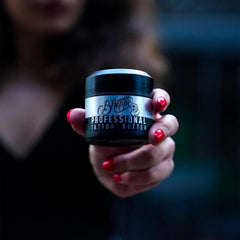 Applying Bheppo Tattoo Butter to skin after tattoo session