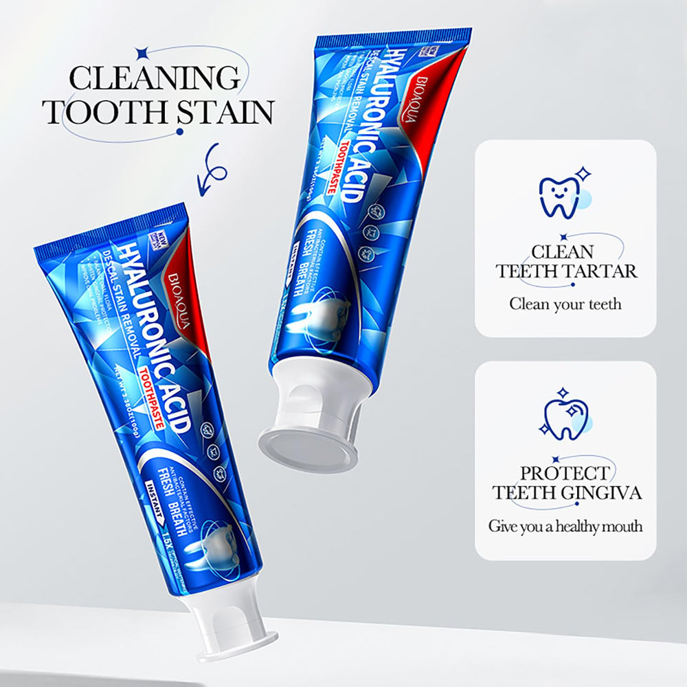 Toothpaste being squeezed onto a toothbrush
