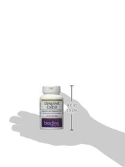 Ubiquinol softgels spilling from bottle