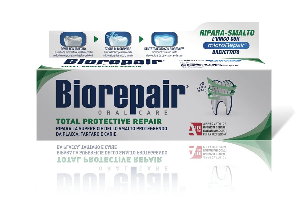 Biorepair toothpaste beside a toothbrush