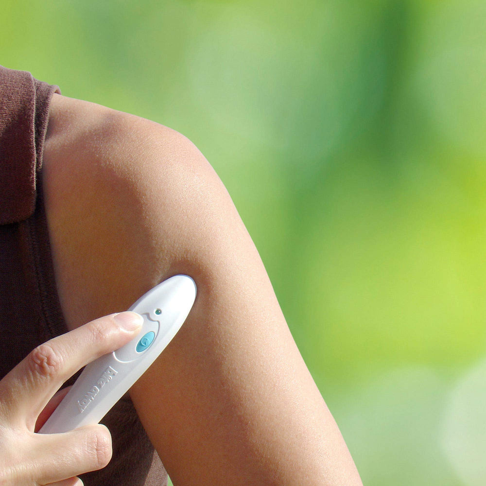 bite away device in hand ready for on-the-go bite relief
