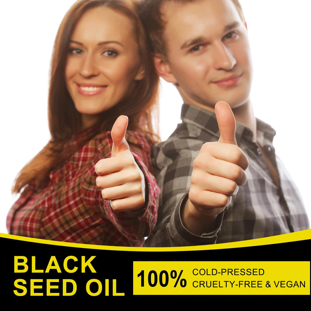 Amber glass bottle with black seed oil and green leaf