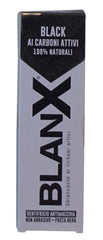 Close-up of Black whitening toothpaste paste with charcoal