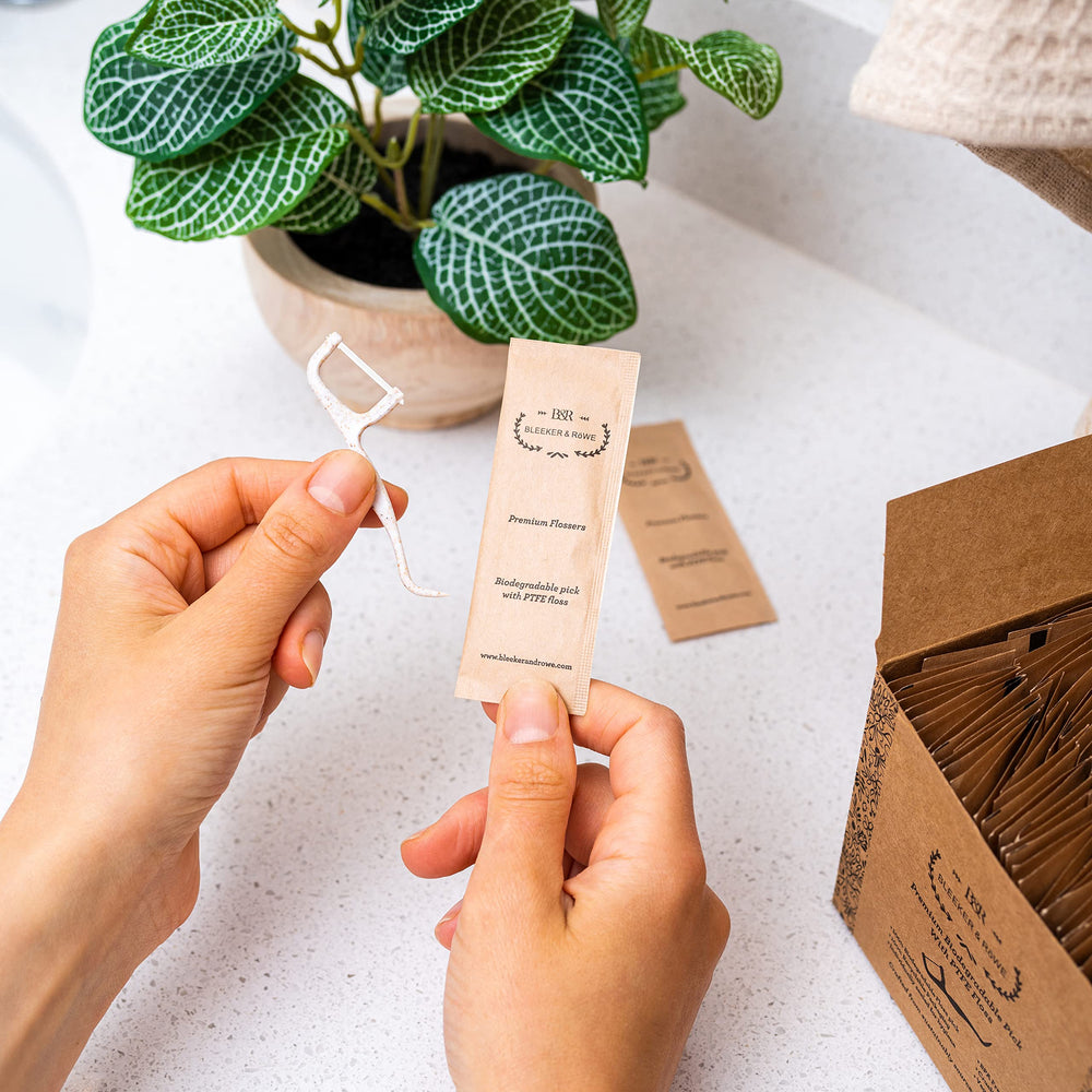 Individually wrapped floss picks in recyclable paper sleeve