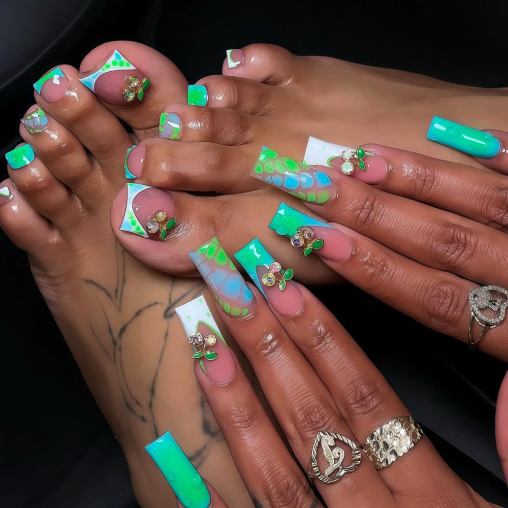 BLGTGH ombre green French tips toenails in long square shape with blue gradient and cherry charm.