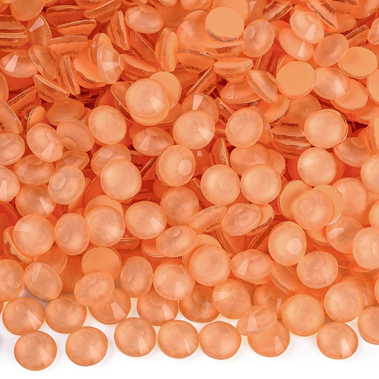 Blinginbox neon flatback rhinestones Living Coral glow for nails and crafts.