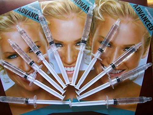 Gel being dispensed from a whitening syringe into a tray