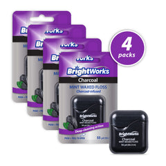 Close-up of BrightWorks Charcoal Dental Floss between teeth