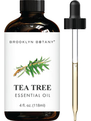 Amber glass bottle of Brooklyn Botany Tea Tree Essential Oil 4 oz with dropper