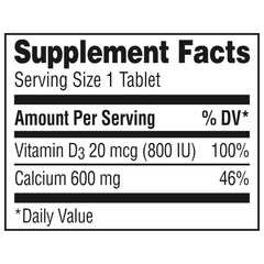 Caltrate bottle beside a glass of water