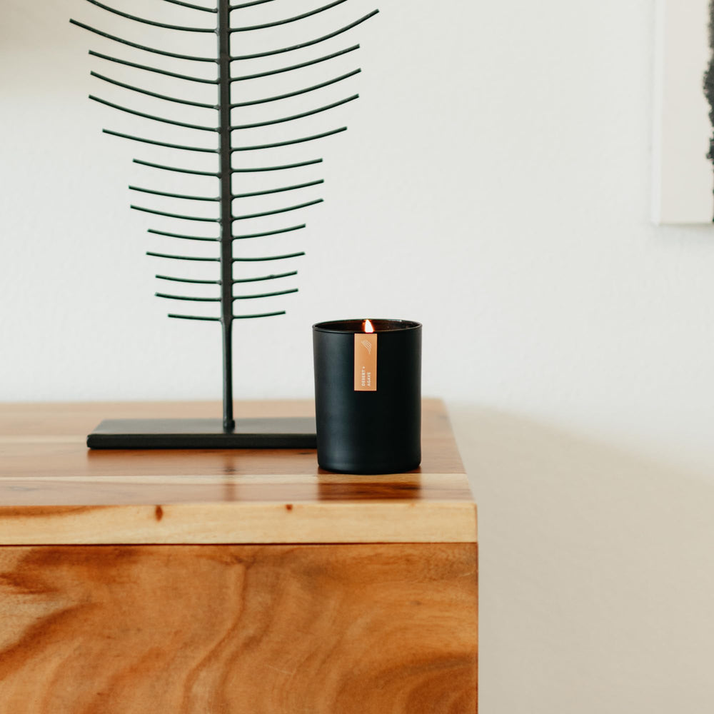 Calyan Wax Co donation impact text and candle