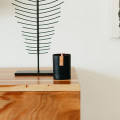 Calyan Wax Co donation impact text and candle