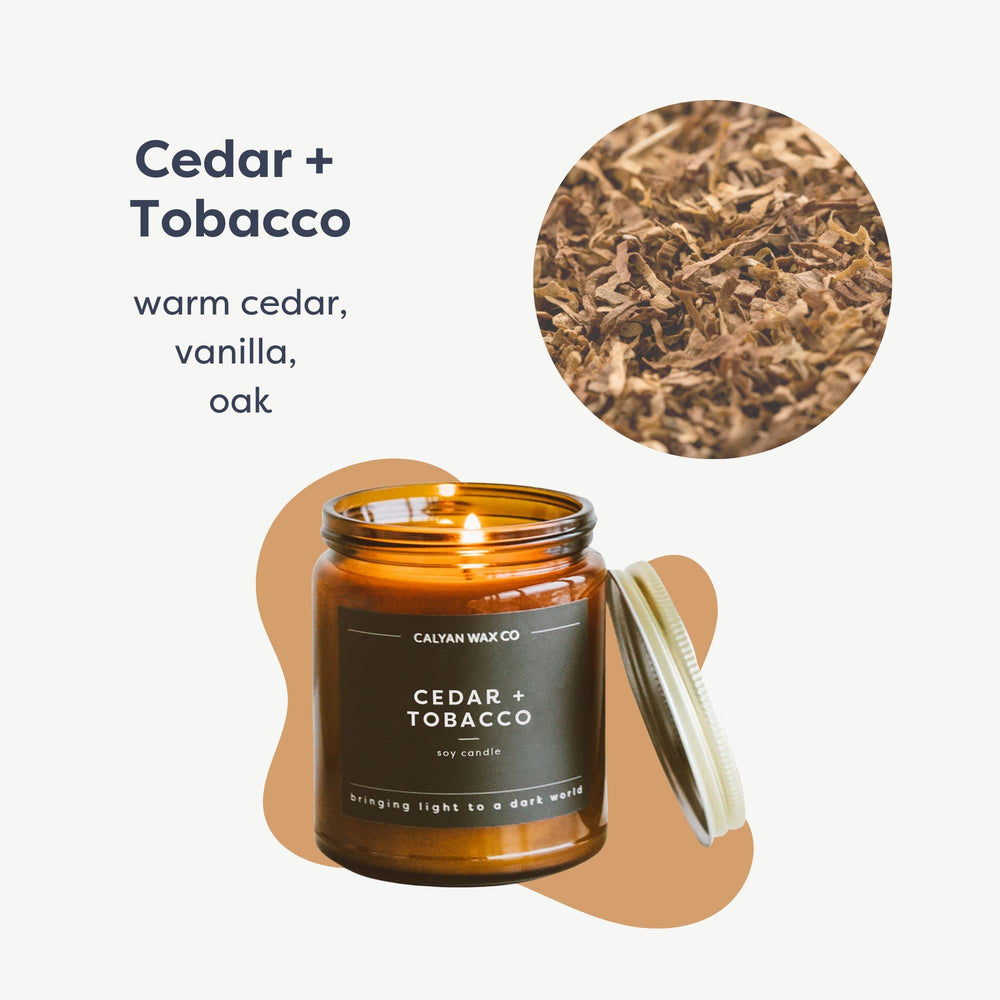 Close-up of Cedar & Tobacco candle label on amber jar