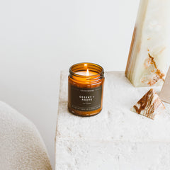 Amber glass jar of Calyan Wax Co candle