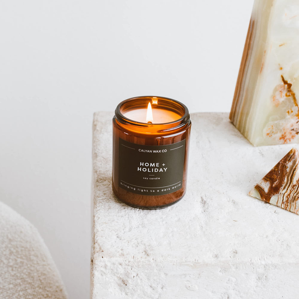 Warm home setting with candle as decor.