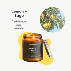 Close-up of lemon and sage scented candle wick in amber jar