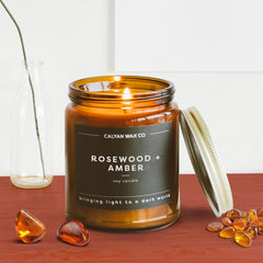 Rosewood and Amber candle on a shelf