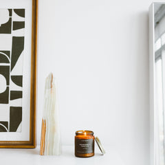 Lifestyle scene featuring Redwood & Vanilla candle in a cozy living space