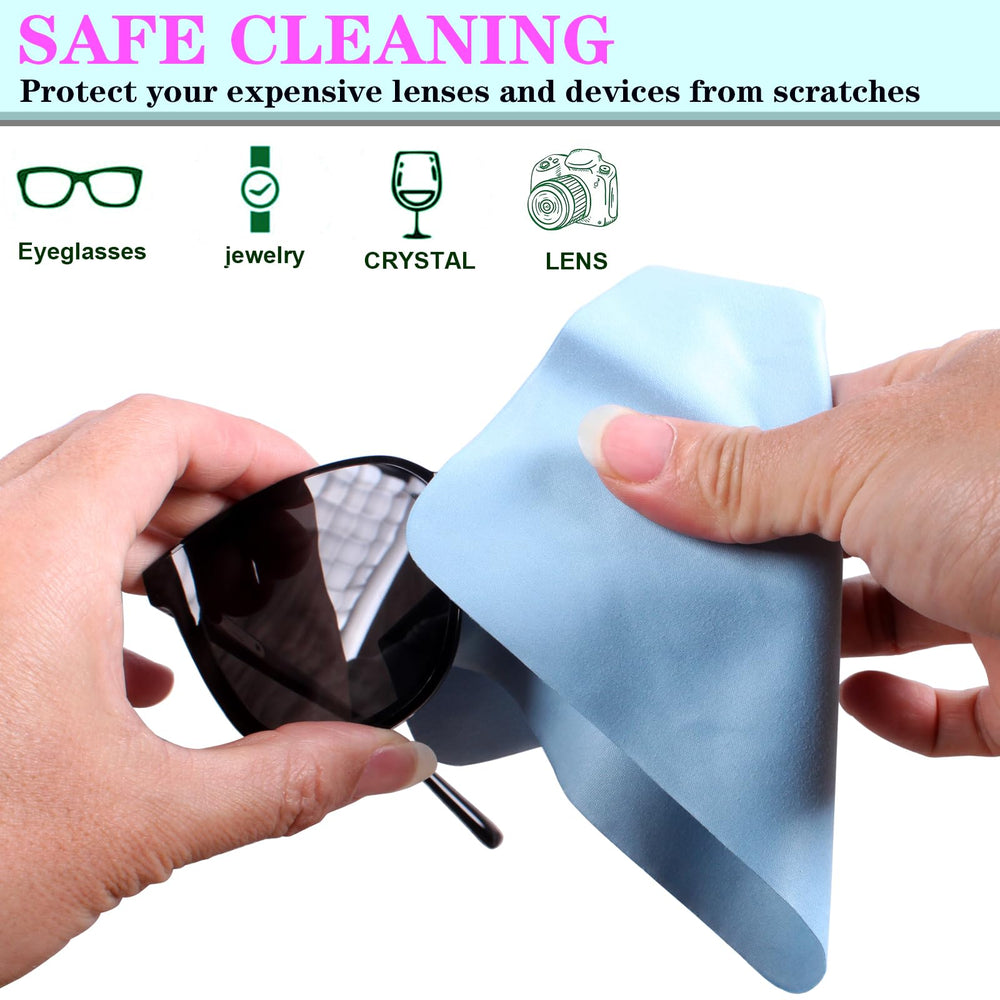 Microfiber cloth cleaning a camera lens