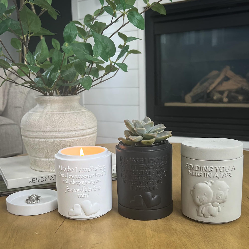 Candle planter repurposed as a chic succulent planter.