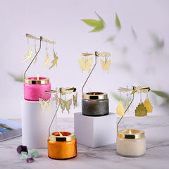 Elegant rotating candle display on a table with warm glow