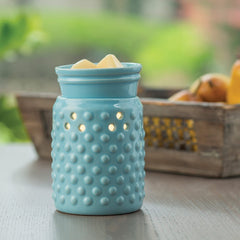 Close-up of blue hobnail glaze on warmer
