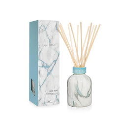 Capri Blue Blue Jean Reed Diffuser Set on a modern marble base