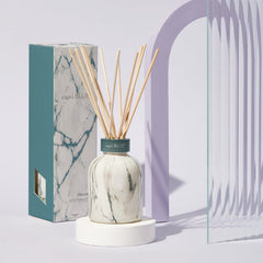 Close-up of reeds soaking in Volcano scented oil