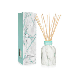 Capri Blue Coconut Santal Modern Marble Reed Diffuser bottle with sticks