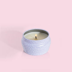 Close-up of wick and melted wax in Capri Blue Volcano 3 oz mini tin candle