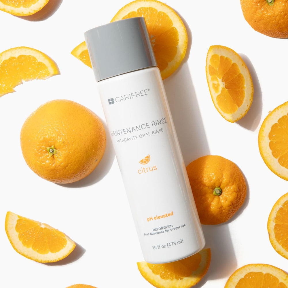 Lifestyle image of clean teeth with CariFree Maintenance Rinse Citrus