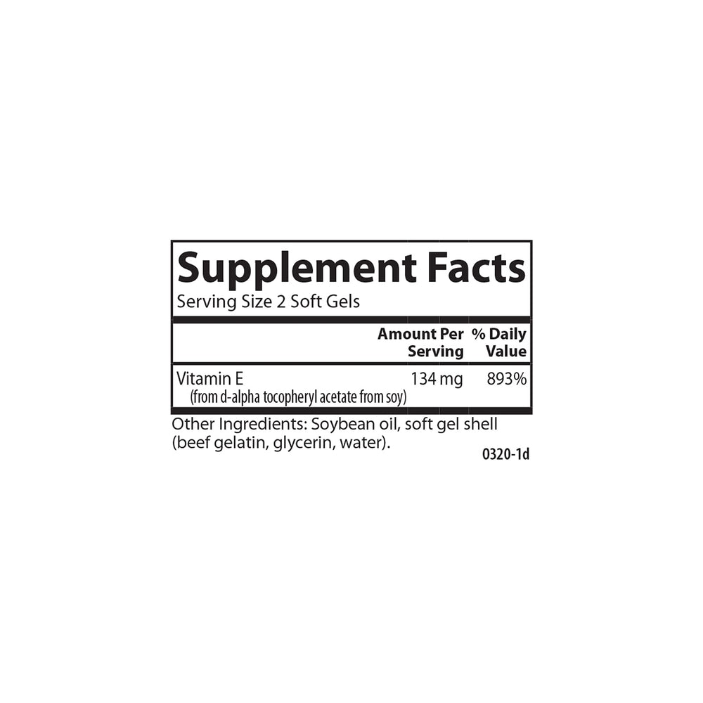 Two Carlson E-Gems Vitamin E soft gels on a white spoon