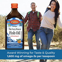 Orange flavor liquid fish oil being dispensed from a dropper