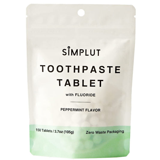 Chewable toothpaste tablets in a reusable travel tin