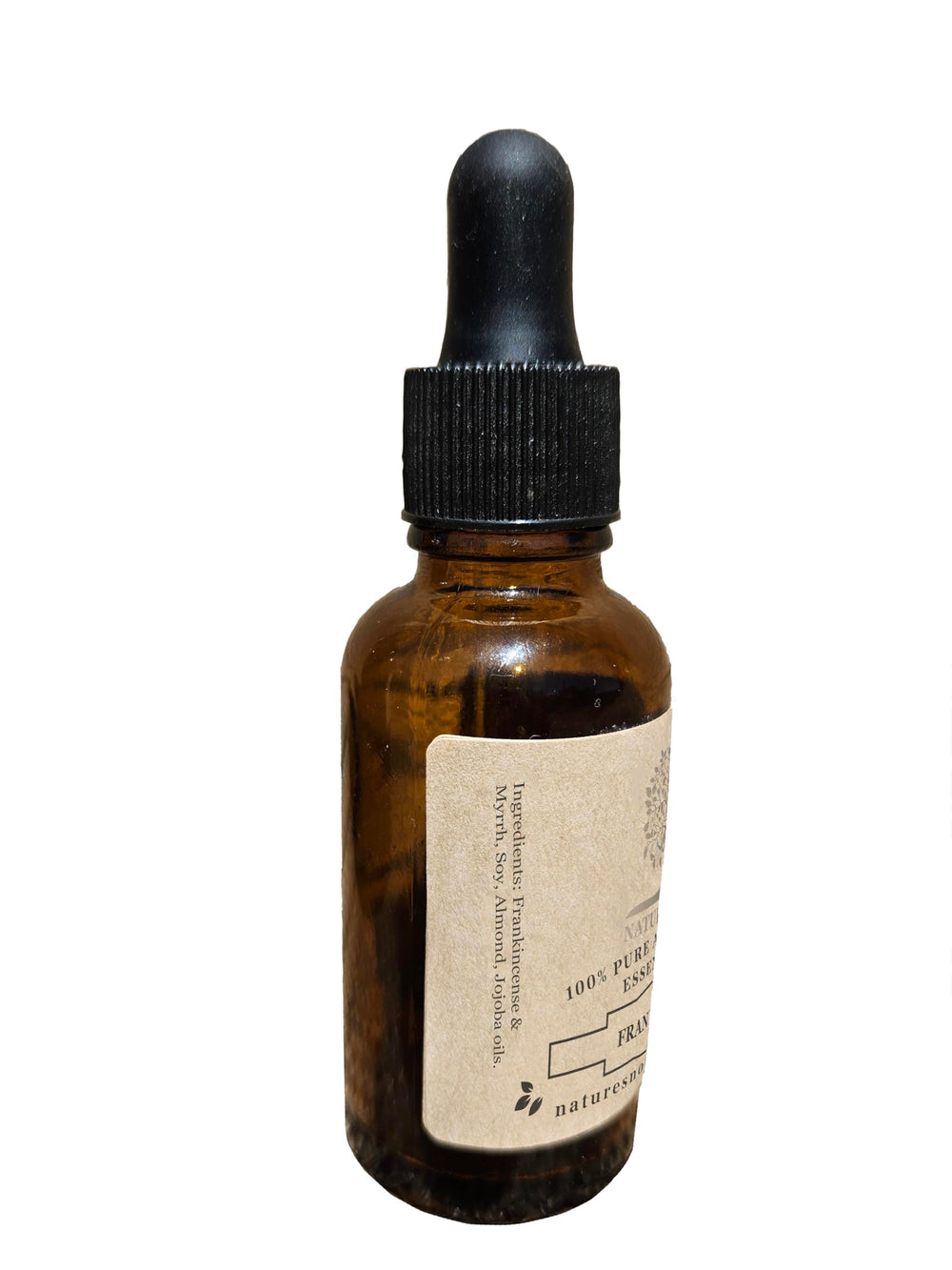 Close-up of the Frankincense & Myrrh essential oil bottle label.
