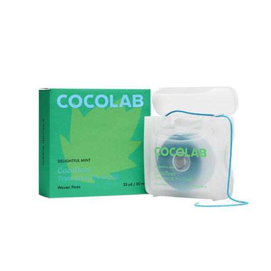Cocofloss woven dental floss mint flavor on white background