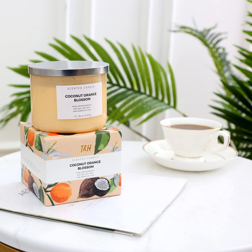 Coconut Orange Blossom candle on a cozy room table.