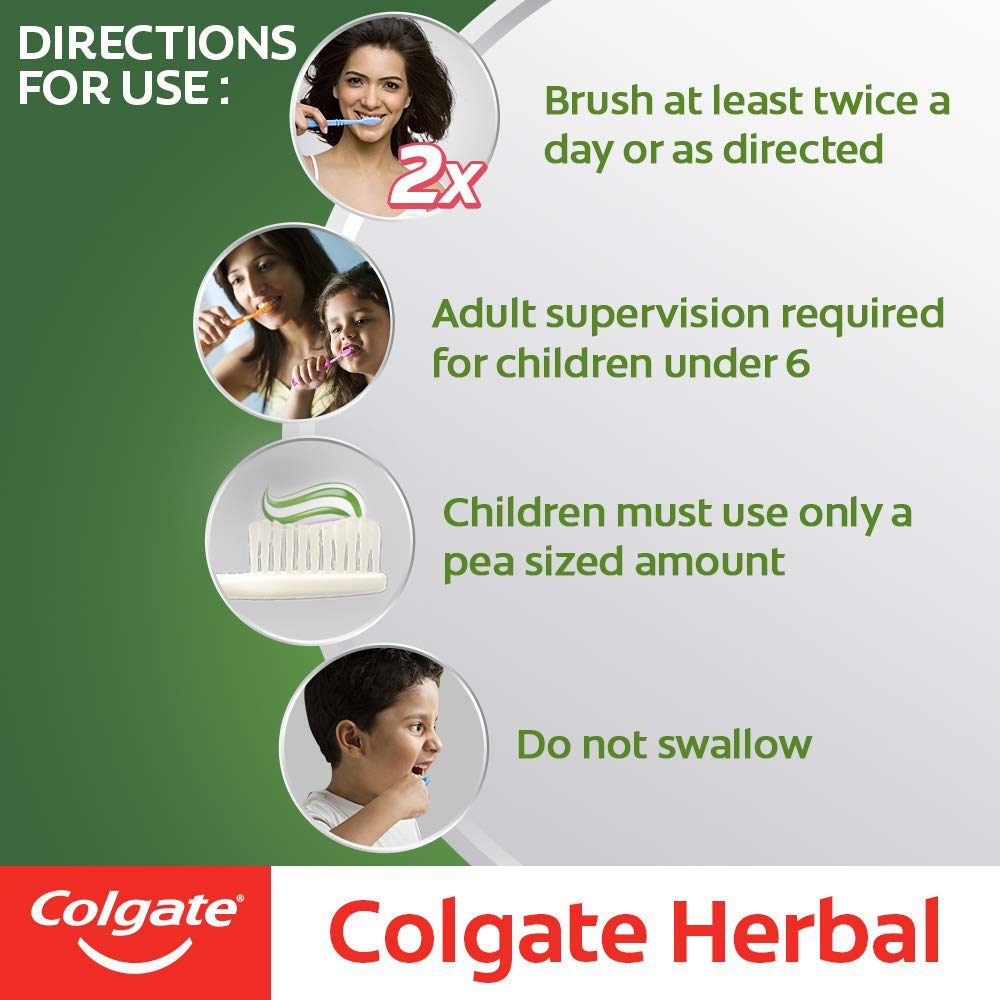 Brushing with Colgate Herbal Toothpaste on a toothbrush