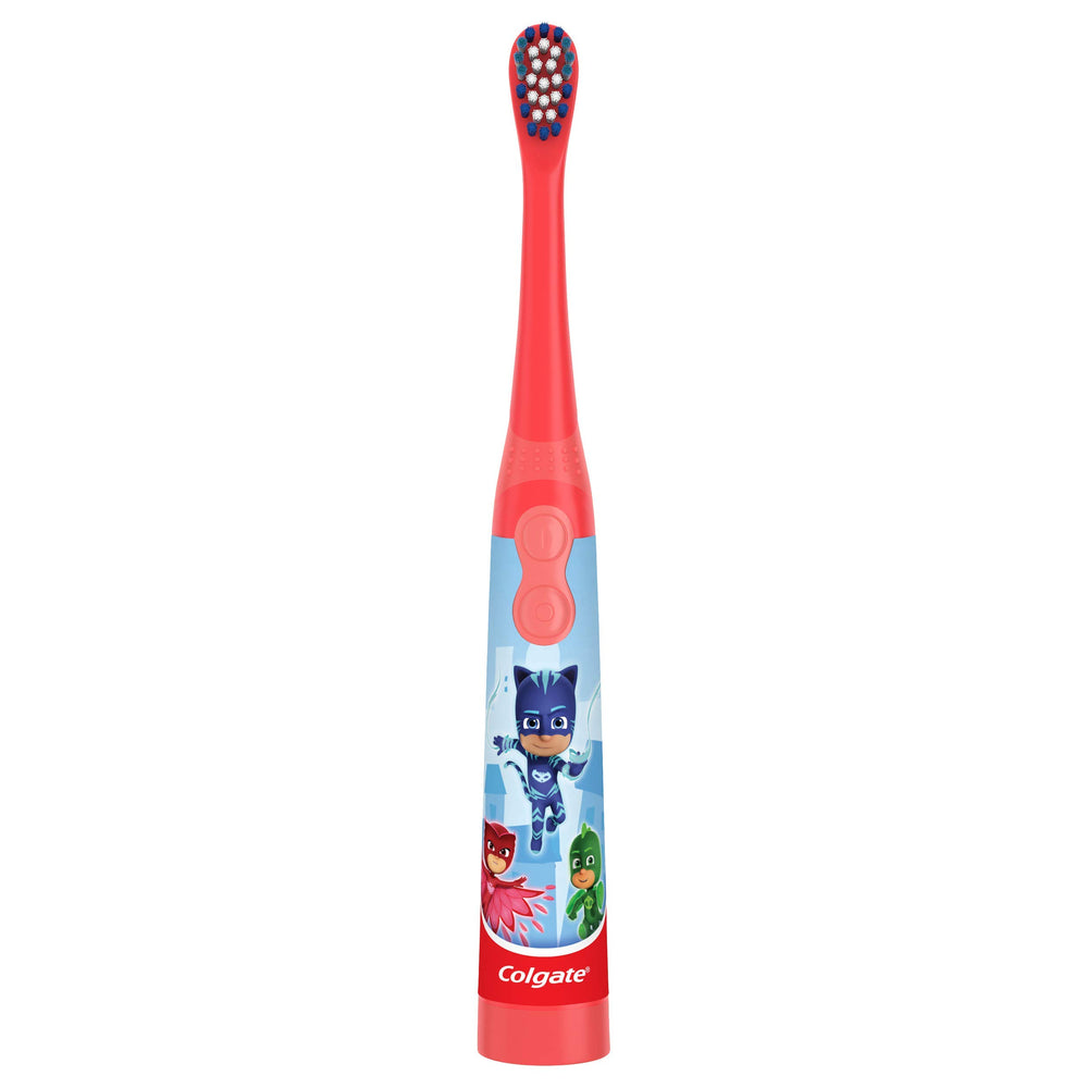 Toothbrush laying flat on surface for toothpaste application