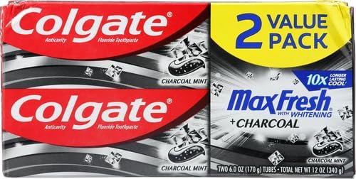Open tube revealing charcoal-infused toothpaste paste