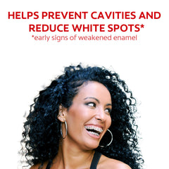 Person using mouthwash with braces